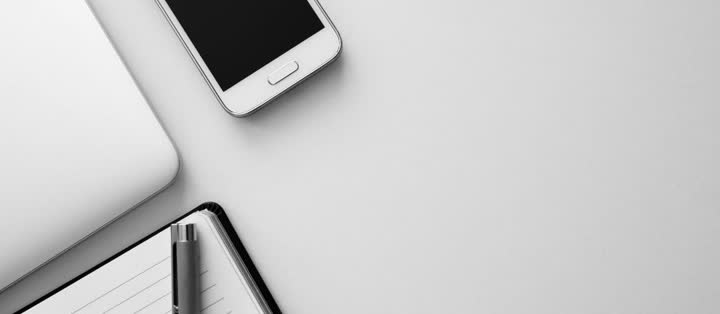 Phone and notepad ready for a fast reply